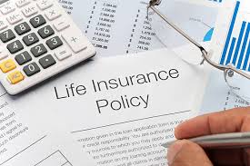calculator, life insurance documents, and a 5-year timeline or calendar